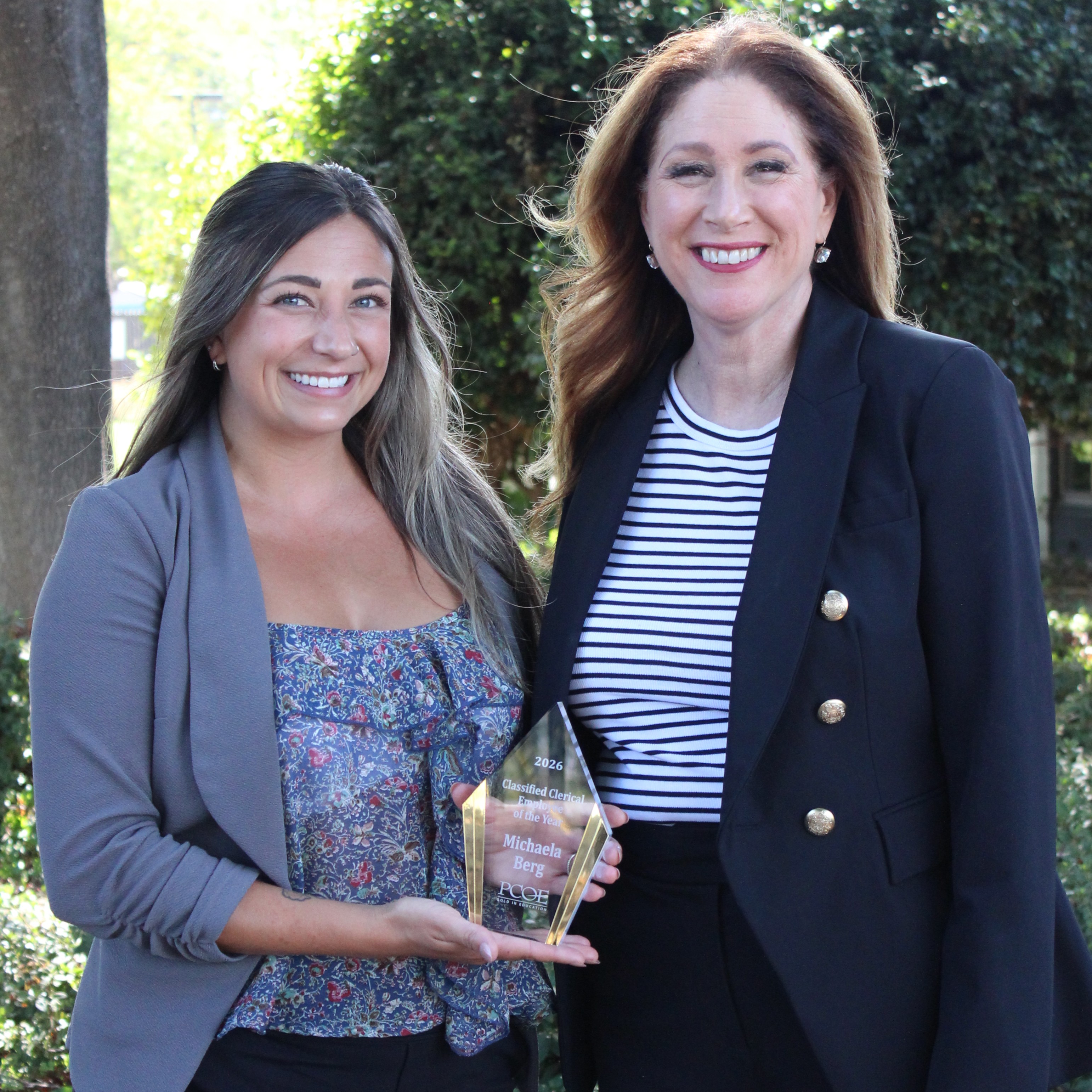 Michaela Berg  with County Suprintendent holding award