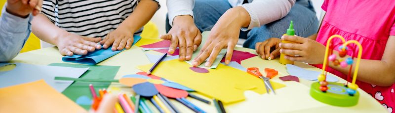 P-3 Children doing crafts with teacher