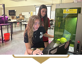 2 girls on a computer